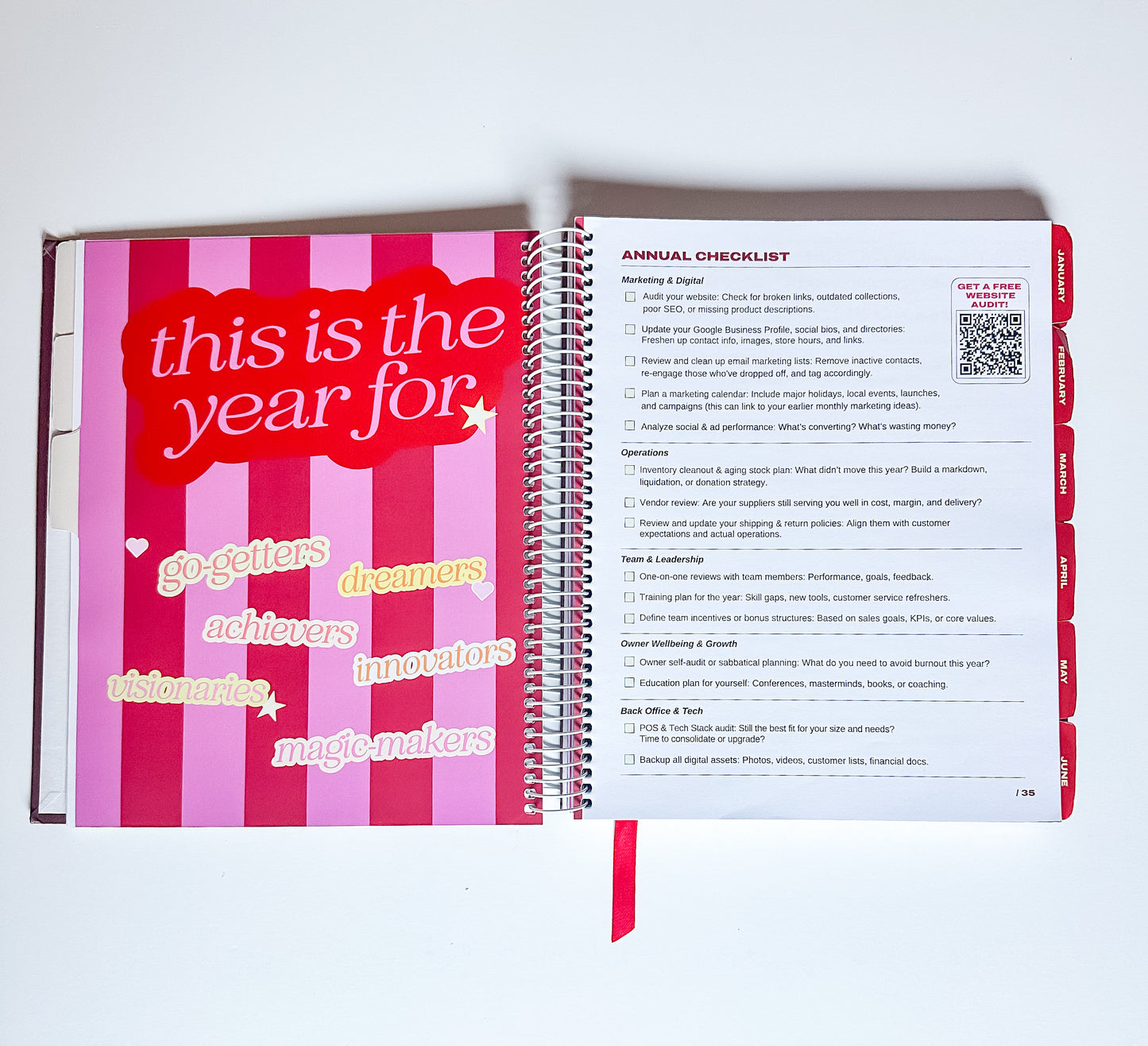 Open planner with motivational text and checklist on a white background